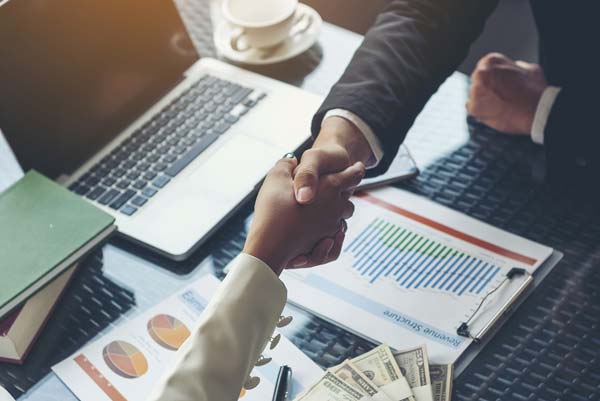 Businessperson shaking hands with a customer | Bardaglio, Hart & Shuman, LLC in Windsor Locks, CT